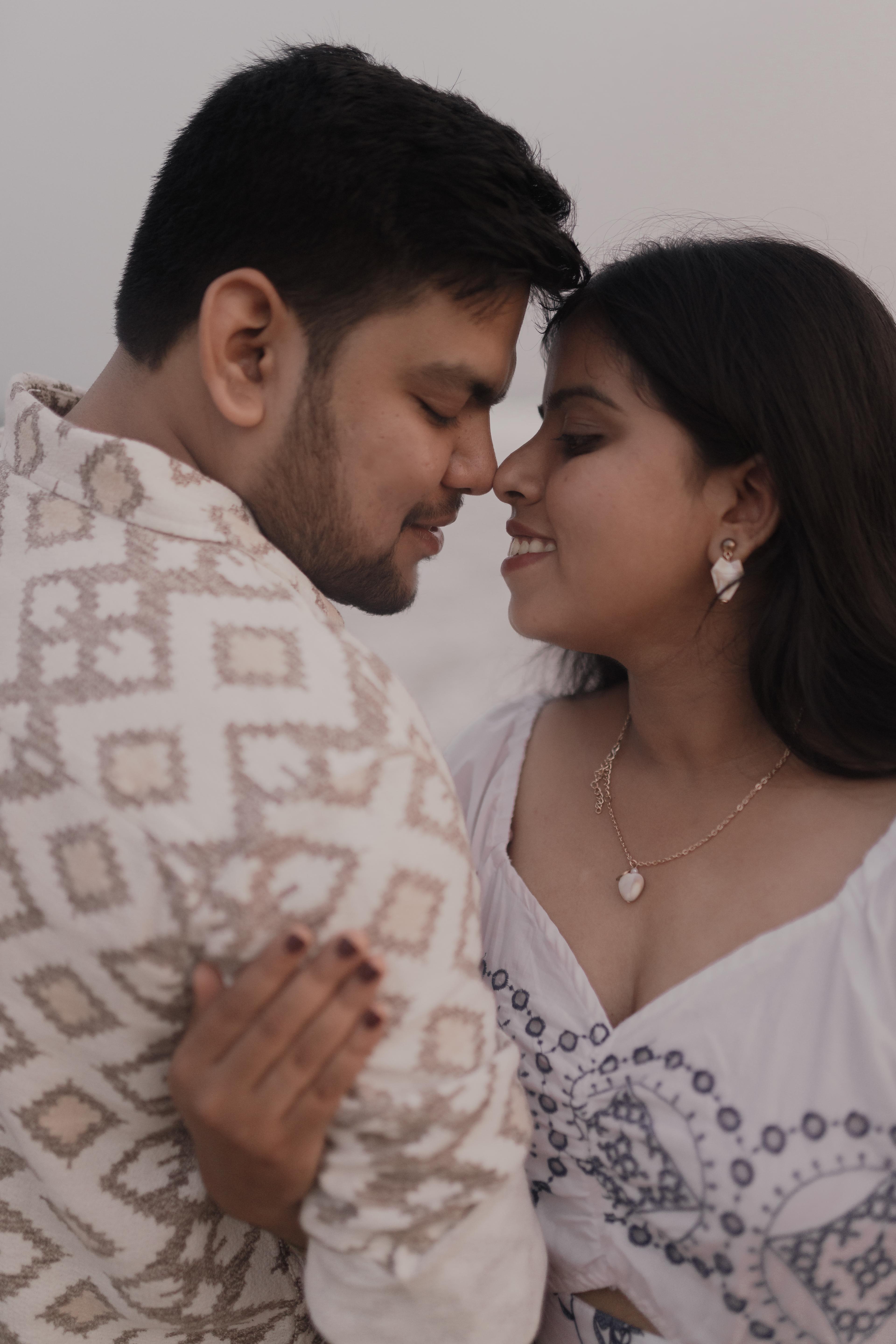 Romantic close-up of an engaged couple sharing an intimate moment, beautifully captured by CaptureCrew Films (TCCF) in natural light. TCCF specializes in showcasing authentic emotions and love through expert pre-wedding photography.